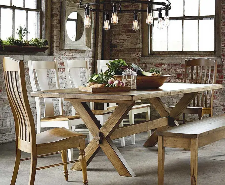 Rustic dining room with wooden table and chairs.